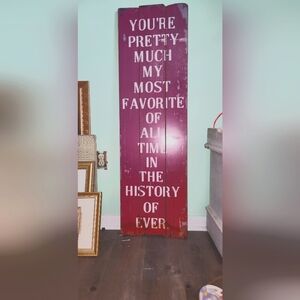 Large pink wooden sign